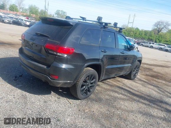 2018 Jeep Grand Cherokee Laredo E with VIN 1C4RJFAG2JC320441, listed as a IAAI auction lot 42095419 with 136,962 mi miles. Bid and sale history available at carsss.com. Image 4.