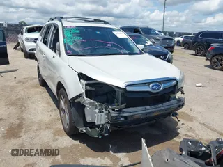 2015 Subaru Forester Touring with VIN JF2SJAWC0FH806493, listed as a IAAI auction lot 42355867 with 128,937 mi miles and . Bid and sale history available at DreamBid. Image 1.