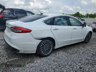 2017 Ford Fusion SE z VIN 3FA6P0H92HR203496, wystawiony jako Copart lot #56719365 z przebiegiem 99 817 mil mil oraz Szkoda całkowita • Salvage title. Historia ofert i sprzedaży dostępna na DreamBid. Obrazek 3.