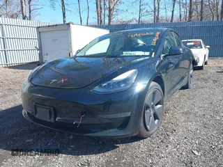 2023 Tesla Model 3 Long Range with VIN 5YJ3E1EB1PF392027, listed as a IAAI auction lot 41983638 with 31,415 mi miles and . Bid and sale history available at DreamBid. Image 2.