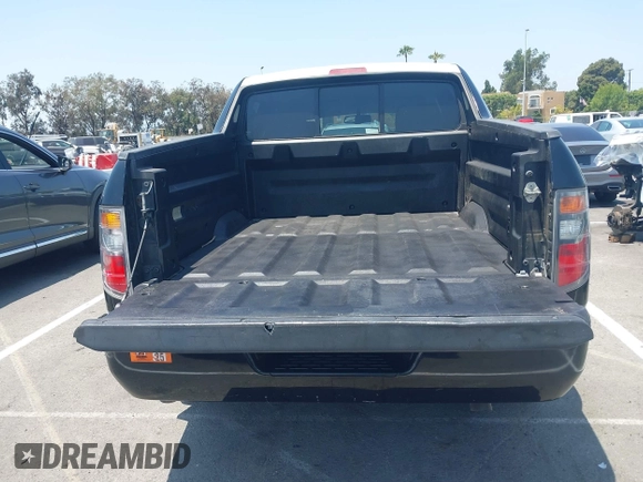 2006 Honda Ridgeline RTL with VIN 2HJYK16576H566002, listed as a IAAI auction lot 42595698 with 212,637 mi miles and . Bid and sale history available at DreamBid. Image 12.
