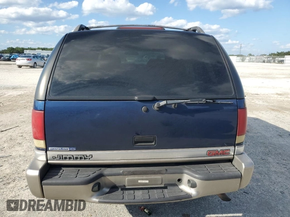 2001 GMC Jimmy SL z VIN 1GKCS13WX12112182, wystawiony jako Copart lot #73460264 z przebiegiem Nie podano mil oraz Nie do naprawy • Non repairable. Historia ofert i sprzedaży dostępna na DreamBid. Obrazek 6.