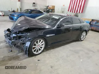 2014 Jaguar XJ with VIN SAJWA1CZ0E8V61168, listed as a Copart auction lot 54383215 with 137,724 mi miles and Salvage Title. Bid and sale history available at DreamBid. Image 1.
