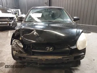 2007 Hyundai Accent SE with VIN KMHCN36C67U026540, listed as a IAAI auction lot 41062633 with 70,143 mi miles. Bid and sale history available at carsss.com. Image 6.