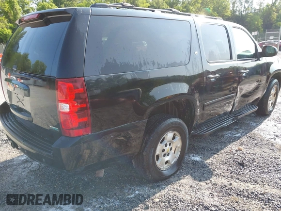 2011 Chevrolet Suburban LT z VIN 1GNSKJE34BR400810, wystawiony jako IAAI lot #42379234 z przebiegiem 273 228 mil mil oraz . Historia ofert i sprzedaży dostępna na DreamBid. Obrazek 4.