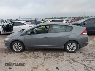 2012 Honda Insight EX z VIN JHMZE2H79CS004299, wystawiony jako IAAI lot #42296207 z przebiegiem 170 288 mil mil oraz . Historia ofert i sprzedaży dostępna na DreamBid. Obrazek 14.