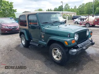 2001 Jeep Wrangler Sahara z VIN 1J4FA59S41P341221, wystawiony jako IAAI lot #42226160 z przebiegiem 138 034 mil mil oraz . Historia ofert i sprzedaży dostępna na DreamBid. Obrazek 1.