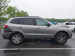 2011 Hyundai Santa Fe GLS z VIN 5XYZGDAB1BG027604, wystawiony jako IAAI lot #42219358 z przebiegiem 145 948 mil mil oraz . Historia ofert i sprzedaży dostępna na DreamBid. Obrazek 13.