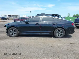 2021 Kia K5 LXS z VIN 5XXG14J25MG052084, wystawiony jako IAAI lot #42237008 z przebiegiem 31 278 mil mil oraz . Historia ofert i sprzedaży dostępna na DreamBid. Obrazek 14.