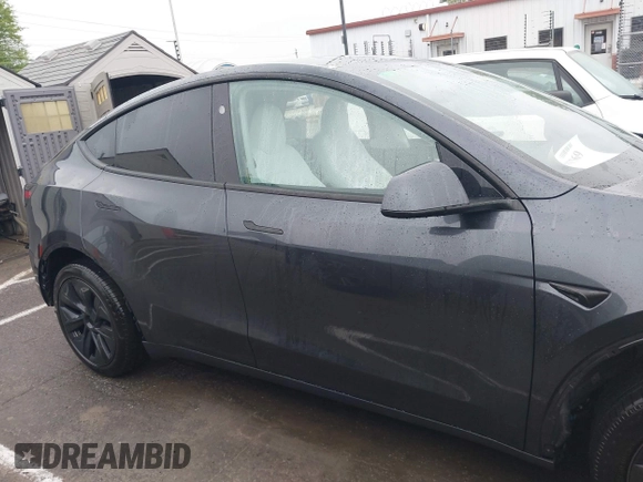 2025 Tesla Model Y Long Range with VIN 7SAYGDED8SA340082, listed as a IAAI auction lot 41915369 with 7,296 mi miles and . Bid and sale history available at DreamBid. Image 14.