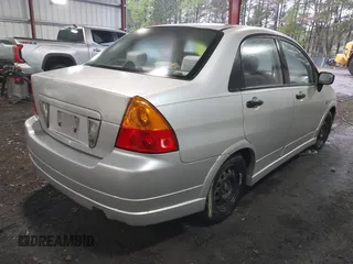2003 Suzuki Aerio S z VIN JS2RA41S335159927, wystawiony jako IAAI lot #42012847 z przebiegiem 132 482 mil mil oraz . Historia ofert i sprzedaży dostępna na DreamBid. Obrazek 4.