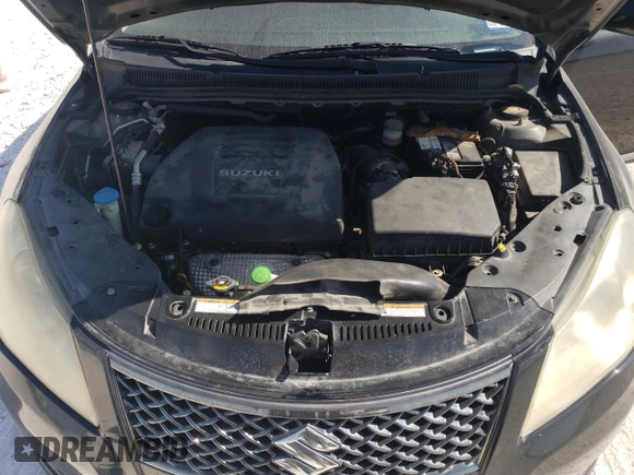 2011 Suzuki Kizashi SE z VIN JS2RE9A34B6111601, wystawiony jako Copart lot #75945784 z przebiegiem 128 926 mil mil oraz Szkoda całkowita • Salvage title. Historia ofert i sprzedaży dostępna na DreamBid. Obrazek 11.