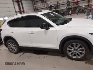 2020 Mazda CX-5 Grand Touring with VIN JM3KFBDM6L1828611, listed as a IAAI auction lot 42006976 with 59,939 mi miles and . Bid and sale history available at DreamBid. Image 14.