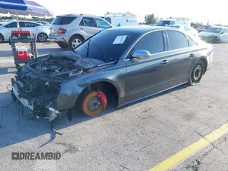 2015 Audi S8 z VIN WAUK2AFD5FN021986, wystawiony jako IAAI lot #41986491 z przebiegiem 142 073 mil mil oraz . Historia ofert i sprzedaży dostępna na DreamBid. Obrazek 2.