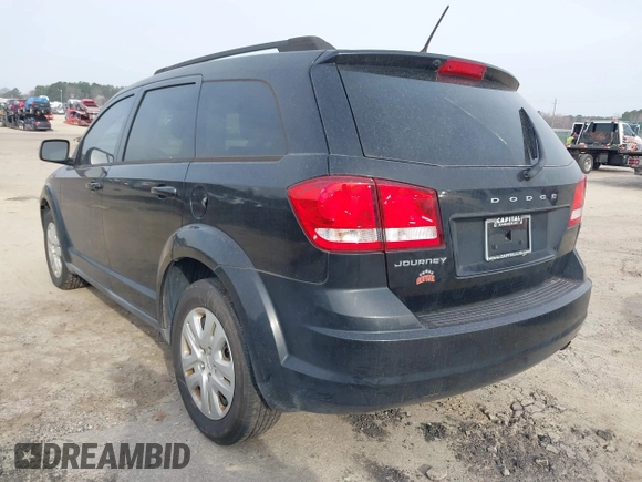 2013 Dodge Journey SE with VIN 3C4PDCAB0DT702977, listed as a IAAI auction lot 41797817 with 150,317 mi miles. Bid and sale history available at carsss.com. Image 3.