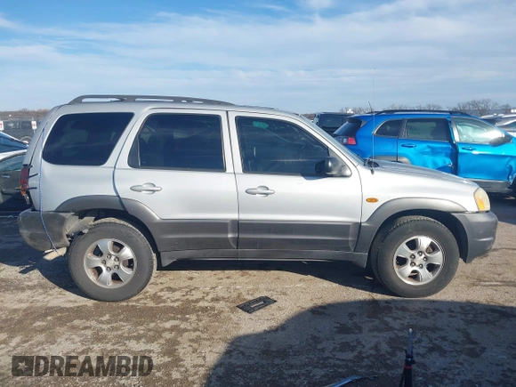 2003 Mazda Tribute LX with VIN 4F2YZ04183KM44733, listed as a IAAI auction lot 41472662 with 246,522 mi miles and . Bid and sale history available at DreamBid. Image 13.