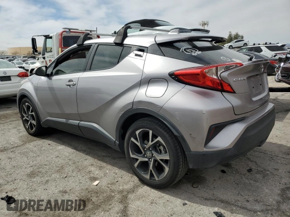 2020 Toyota C-HR LE with VIN JTNKHMBX7L1065098, listed as a Copart auction lot 50101395 with 51,933 mi miles and Salvage Title. Bid and sale history available at DreamBid. Image 2.