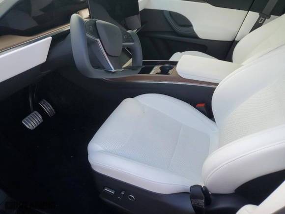 2023 Tesla Model X with VIN 7SAXCBE50PF402119, listed as a Copart auction lot 69883384 with 8,018 mi miles and Clean Title. Bid and sale history available at carsss.com. Image 7.