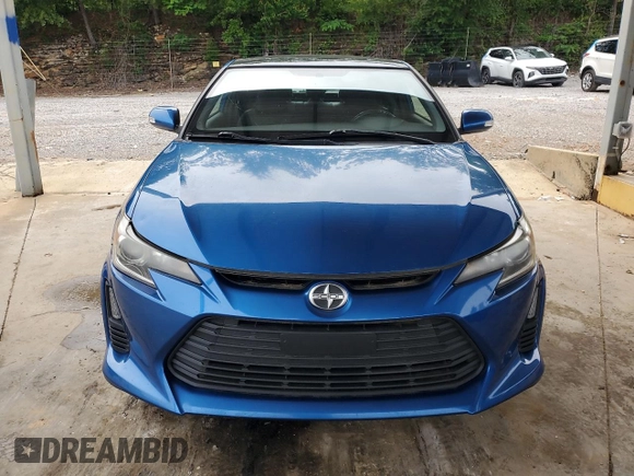 2014 Scion tC z VIN JTKJF5C76E3087992, wystawiony jako Copart lot #56058445 z przebiegiem 84 387 mil mil oraz Czysty tytuł • Clean title. Historia ofert i sprzedaży dostępna na DreamBid. Obrazek 5.