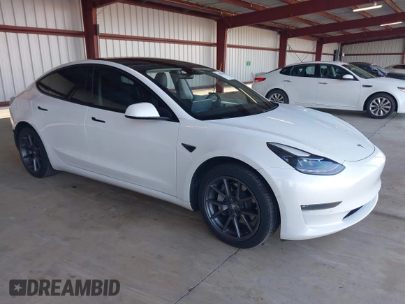 2021 Tesla Model 3 Long Range with VIN 5YJ3E1EB3MF003027, listed as a IAAI auction lot 41859036 with 102,302 mi miles and . Bid and sale history available at carsss.com. Image 1.