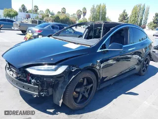 2020 Tesla Model X Long Range with VIN 5YJXCAE24LF272238, listed as a IAAI auction lot 40251868 with 99,362 mi miles. Bid and sale history available at carsss.com. Image 2.