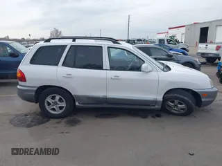 2004 Hyundai Santa Fe GLS with VIN KM8SC13DX4U609921, listed as a IAAI auction lot 41619492 with 113,592 mi miles. Bid and sale history available at carsss.com. Image 13.