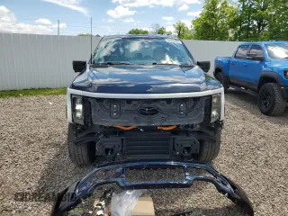 2022 Ford F-150 Lightning Pro z VIN 1FTVW1EL6NWG04931, wystawiony jako Copart lot #59096435 z przebiegiem 26 616 mil mil oraz Szkody całkowita. Historia ofert i sprzedaży dostępna na DreamBid. Obrazek 5.