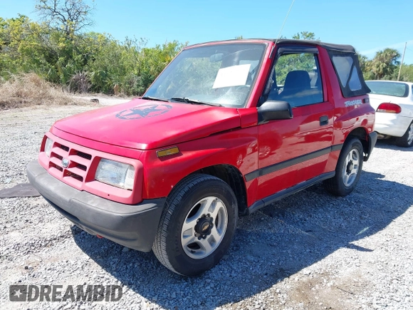 1998 Chevrolet Tracker z VIN 2CNBE1866W6924835, wystawiony jako IAAI lot #41821459 z przebiegiem 54 512 mil mil oraz . Historia ofert i sprzedaży dostępna na DreamBid. Obrazek 2.