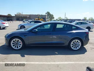2022 Tesla Model 3 with VIN 5YJ3E1EA6NF144098, listed as a IAAI auction lot 41965360 with 75,597 mi miles. Bid and sale history available at carsss.com. Image 14.