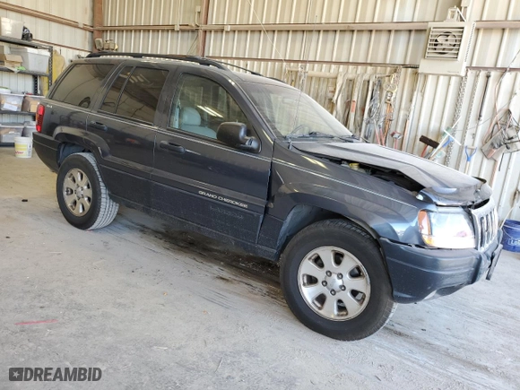 2001 Jeep Grand Cherokee Laredo with VIN 1J4GW48N41C557380, listed as a Copart auction lot 74080604 with 58,005 mi miles and Salvage Title. Bid and sale history available at carsss.com. Image 4.