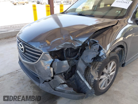 2016 Mazda CX-5 Sport with VIN JM3KE4BY1G0910102, listed as a IAAI auction lot 42115163 with 144,495 mi miles and . Bid and sale history available at carsss.com. Image 6.