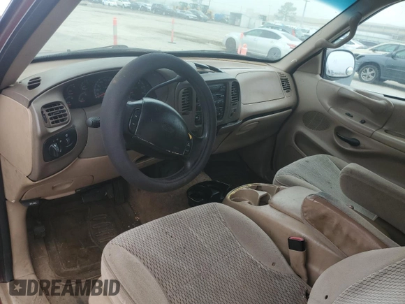 1997 Ford F-150 with VIN 2FTDX1726VCA74811, listed as a Copart auction lot 81909844 with 136,520 mi miles and Salvage title. Bid and sale history available at DreamBid. Image 8.