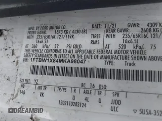 2021 Ford Transit Cargo with VIN 1FTBW1X84MKA98047, listed as a IAAI auction lot 42313747 with 65,600 mi miles and . Bid and sale history available at DreamBid. Image 9.
