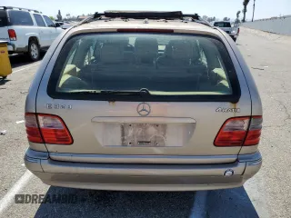 2000 Mercedes-Benz E-Class AWD with VIN WDBJH82J8YX042547, listed as a Copart auction lot 58063494 with 138,392 mi miles and Salvage Title. Bid and sale history available at carsss.com. Image 6.