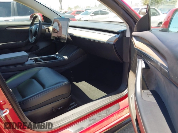 2023 Tesla Model 3 z VIN 5YJ3E1EA4PF454981, wystawiony jako IAAI lot #42704135 z przebiegiem 93 008 mil mil oraz . Historia ofert i sprzedaży dostępna na DreamBid. Obrazek 5.