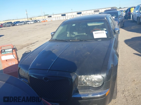 2006 Chrysler 300 C with VIN 2C3LA63H56H246663, listed as a IAAI auction lot 40894432 with 145,629 mi miles. Bid and sale history available at carsss.com. Image 6.