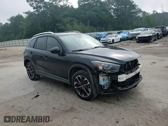 2016 Mazda CX-5 Grand Touring z VIN JM3KE2DY5G0676290, wystawiony jako Copart lot #54155325 z przebiegiem 124 743 mil mil oraz Szkoda całkowita • Salvage title. Historia ofert i sprzedaży dostępna na DreamBid. Obrazek 15.