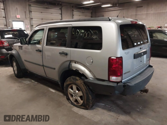 2007 Dodge Nitro SXT with VIN 1D8GU28K47W569317, listed as a IAAI auction lot 41740052 with 220,265 mi miles. Bid and sale history available at carsss.com. Image 3.