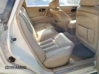 1994 Infiniti Q45 z VIN JNKNG01D3RM252218, wystawiony jako Copart lot #77230944 z przebiegiem 69 069 mil mil oraz Tytuł czysty. Historia ofert i sprzedaży dostępna na DreamBid. Obrazek 10.