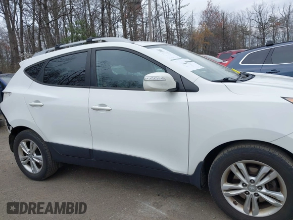 2013 Hyundai Tucson GLS with VIN KM8JU3AC5DU693550, listed as a IAAI auction lot 41919615 with 202,517 mi miles. Bid and sale history available at carsss.com. Image 13.
