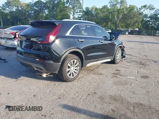 2021 Cadillac XT4 FWD Premium Luxury with VIN 1GYFZCR47MF000064, listed as a IAAI auction lot 41974115 with 1 mi miles. Bid and sale history available at carsss.com. Image 4.