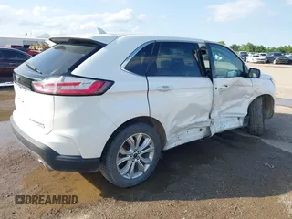 2020 Ford Edge Titanium z VIN 2FMPK3K98LBA42159, wystawiony jako IAAI lot #42358229 z przebiegiem 88 512 mil mil oraz . Historia ofert i sprzedaży dostępna na DreamBid. Obrazek 4.