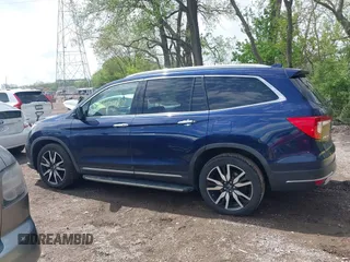 2019 Honda Pilot Touring 7-Passenger z VIN 5FNYF6H63KB000365, wystawiony jako IAAI lot #42154822 z przebiegiem 238 032 mil mil oraz . Historia ofert i sprzedaży dostępna na DreamBid. Obrazek 15.