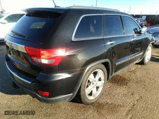 2012 Jeep Grand Cherokee Overland with VIN 1C4RJFCT8CC268410, listed as a IAAI auction lot 41823909 with 205,940 mi miles. Bid and sale history available at carsss.com. Image 4.