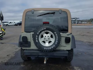 1999 Jeep Wrangler Sahara with VIN 1J4FY49S0XP480017, listed as a IAAI auction lot 41642577 with 154,068 mi miles. Bid and sale history available at carsss.com. Image 16.