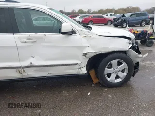 2012 Jeep Grand Cherokee Laredo with VIN 1C4RJFAG6CC297958, listed as a IAAI auction lot 40859811 with 213,499 mi miles. Bid and sale history available at carsss.com. Image 18.