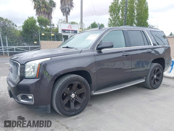 2015 GMC Yukon SLT with VIN 1GKS1BKC6FR245564, listed as a IAAI auction lot 42139295 with 149,088 mi miles. Bid and sale history available at carsss.com. Image 2.