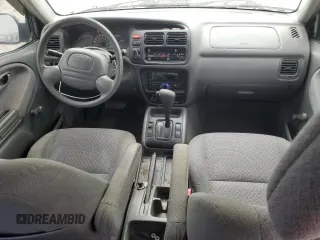 2002 Chevrolet Tracker z VIN 2CNBE13C926934704, wystawiony jako Copart lot #70717194 z przebiegiem 189 076 mil mil oraz Szkody całkowita. Historia ofert i sprzedaży dostępna na DreamBid. Obrazek 8.