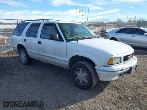 1996 GMC Jimmy SL z VIN 1GKDT13W8T2522192, wystawiony jako IAAI lot #41439548 z przebiegiem 262 152 mil mil oraz . Historia ofert i sprzedaży dostępna na DreamBid. Obrazek 1.