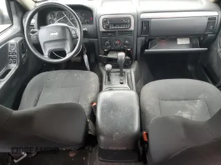 2003 Jeep Grand Cherokee Laredo z VIN 1J4GW48S53C568929, wystawiony jako Copart lot #57604245 z przebiegiem 216 103 mil mil oraz Czysty tytuł • Clean title. Historia ofert i sprzedaży dostępna na DreamBid. Obrazek 8.